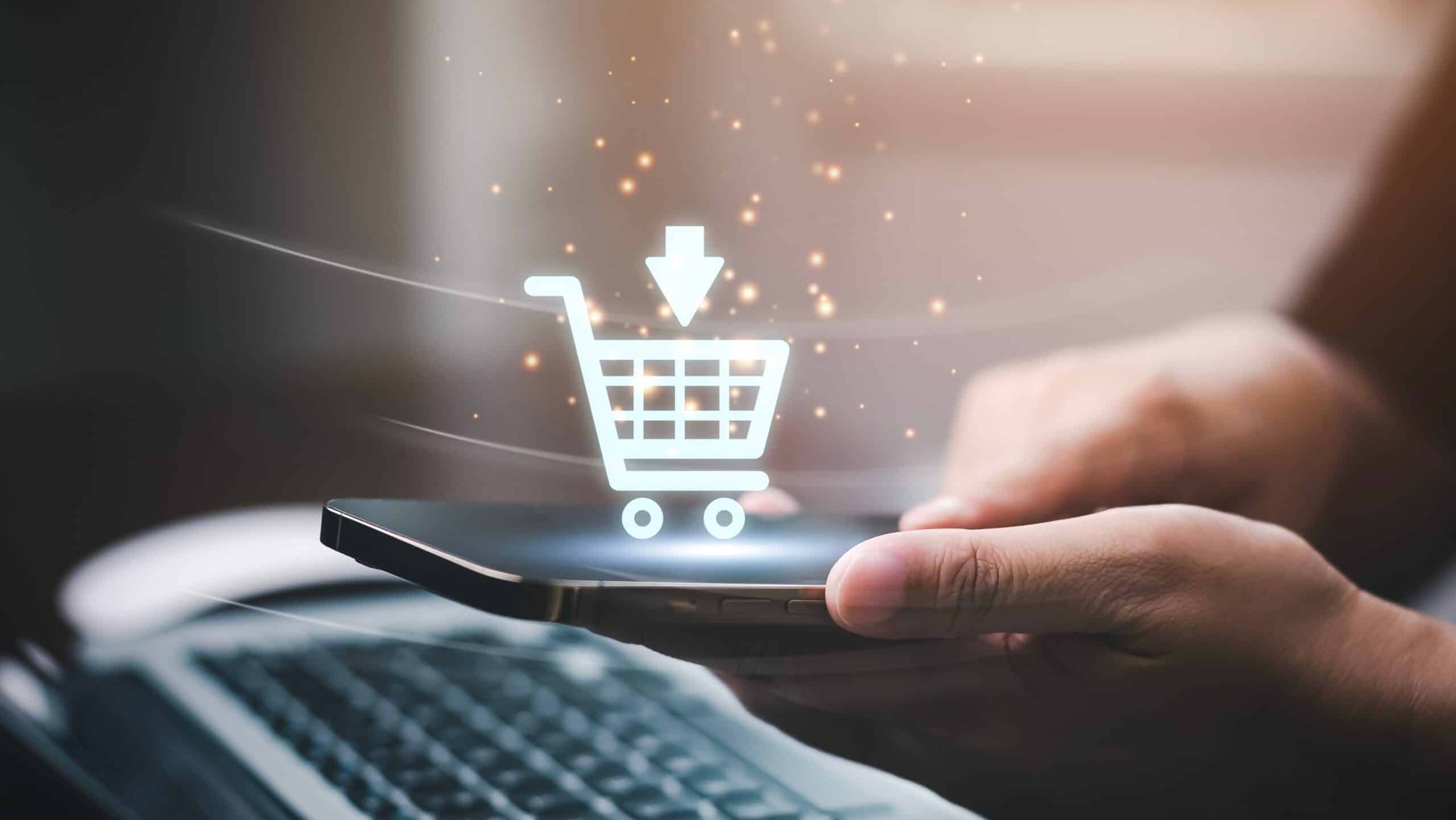 Businessman using a laptop with online shopping concept, marketplace website with virtual interface of online Shopping cart part of the network, Online shopping business with selecting shopping cart.